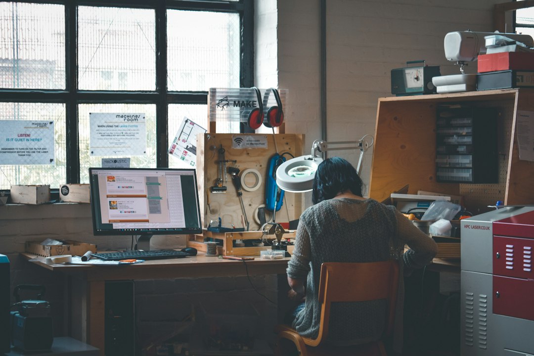 woman sitting in front of a wooden desk - Photo by Darya Tryfanava on Unsplash