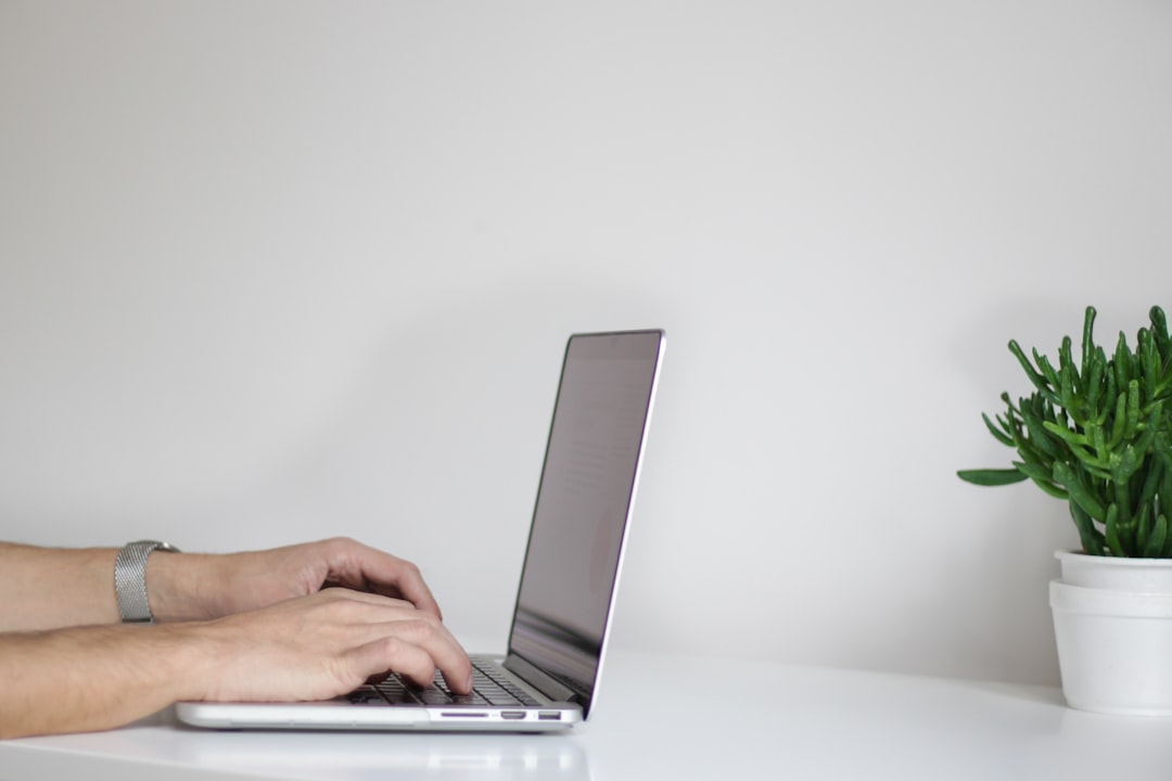 person using laptop - Photo by NordWood Themes on Unsplash