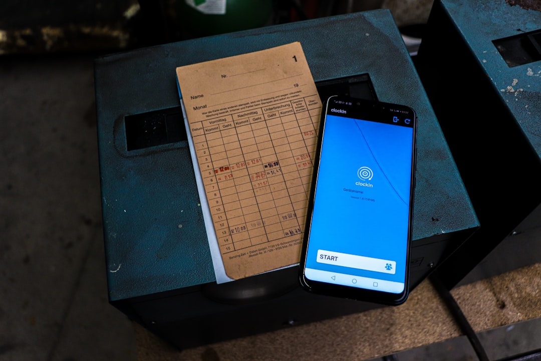 a cell phone sitting on top of a table next to a piece of paper - Photo by Jonas Tünte on Unsplash