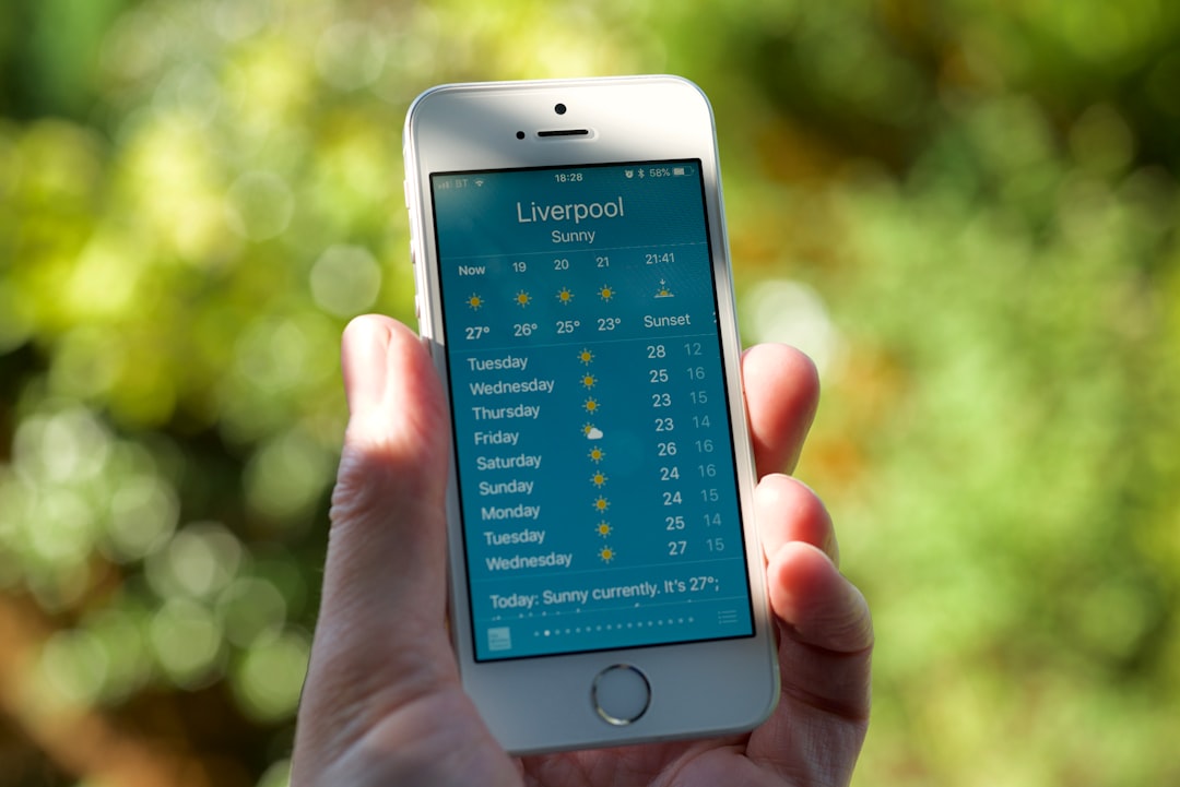 person holding turned on silver iPhone 5s displaying liverpool - Photo by Gavin Allanwood on Unsplash