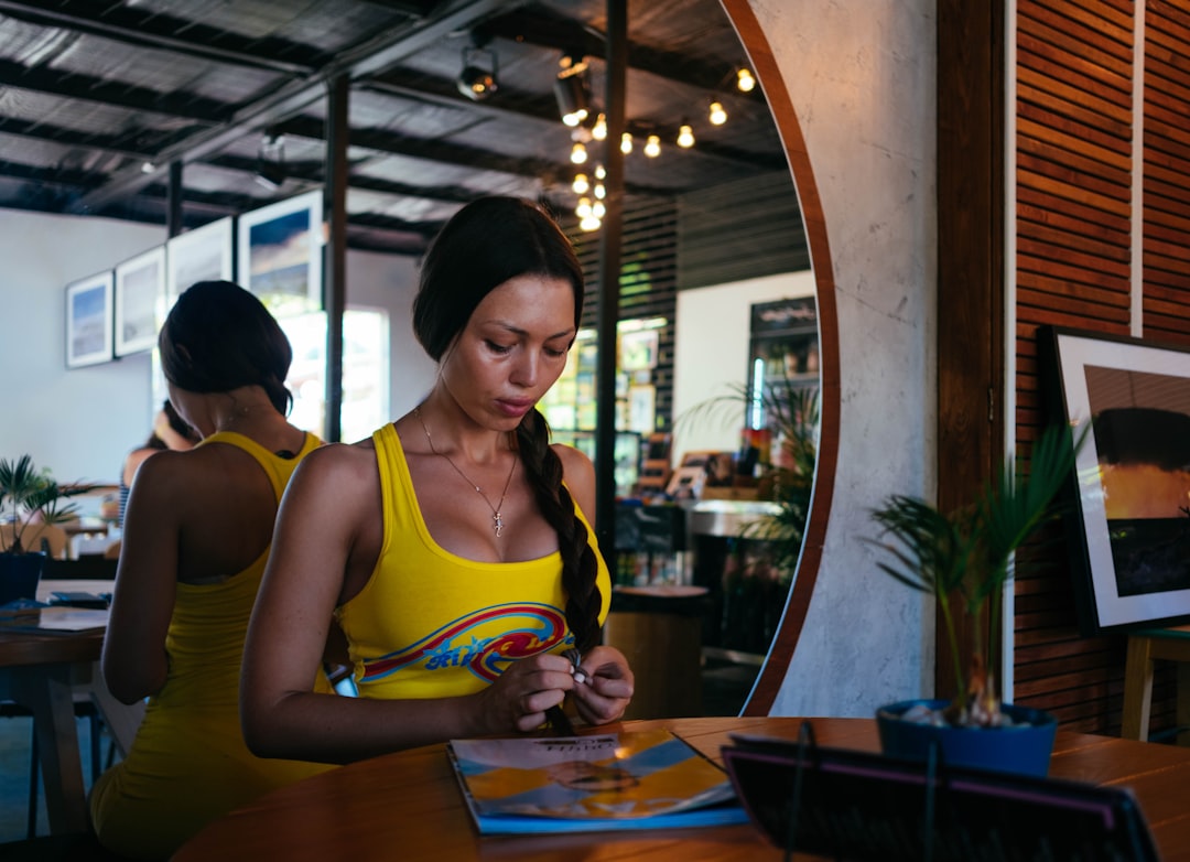 woman standing in front of table - Photo by Igor Starkov on Unsplash