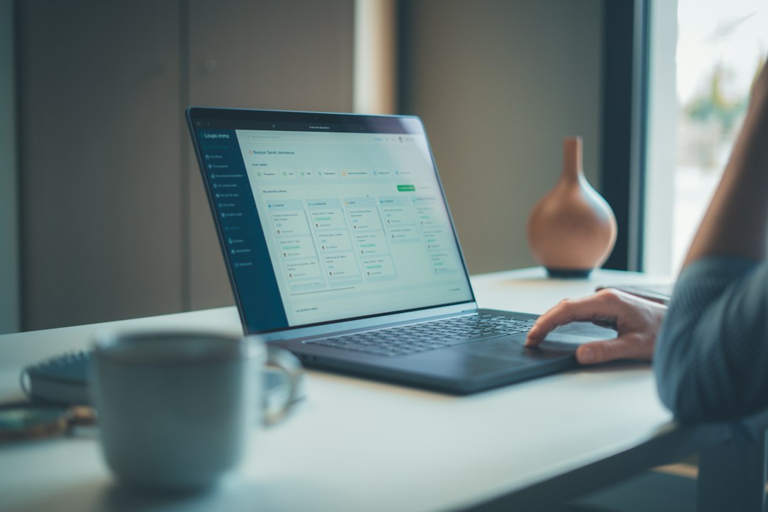 Person working on a laptop at a desk - Photo by Gabriel Weyand on Unsplash