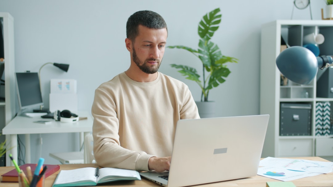Man working on a laptop at a desk. — Photo by Vitaly Gariev on Unsplash