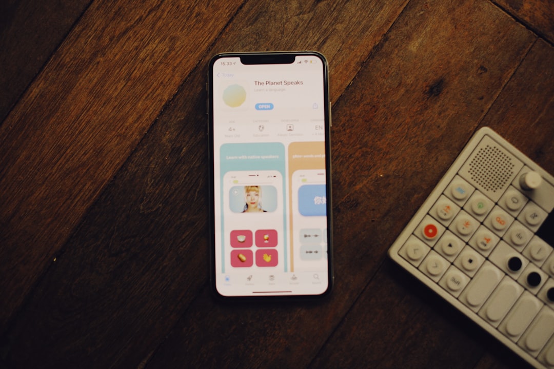 a cell phone sitting next to a remote control — Photo by Alexey Demidov on Unsplash