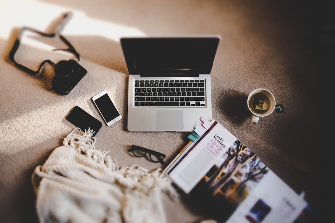 white ceramic mug near MacBook Pro - Photo by Ewan Robertson on Unsplash