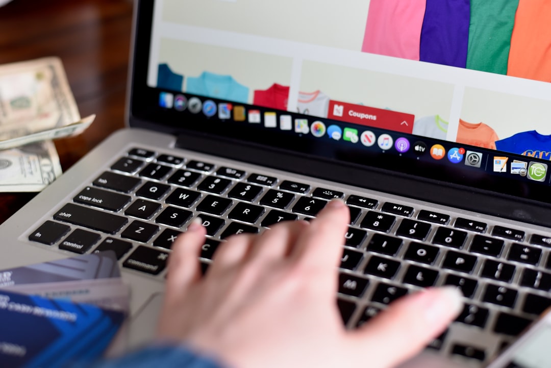 person using macbook pro turned on displaying game application - Photo by Olga DeLawrence on Unsplash