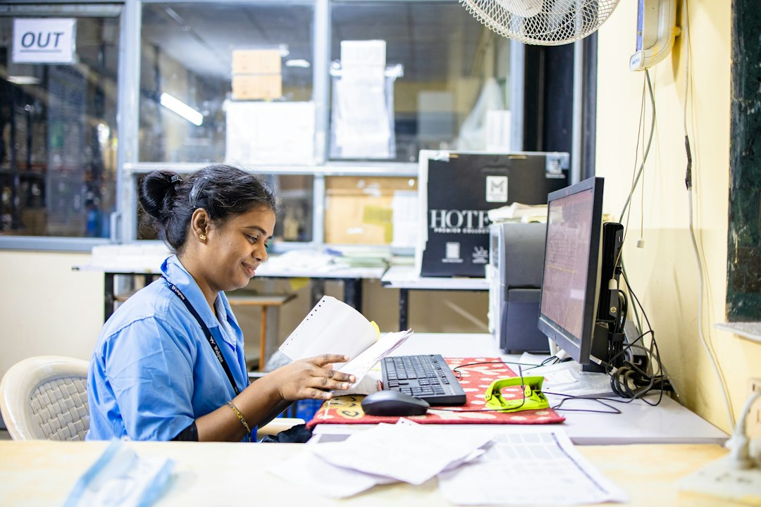 Woman works at her desk in an office - Photo by EqualStock on Unsplash