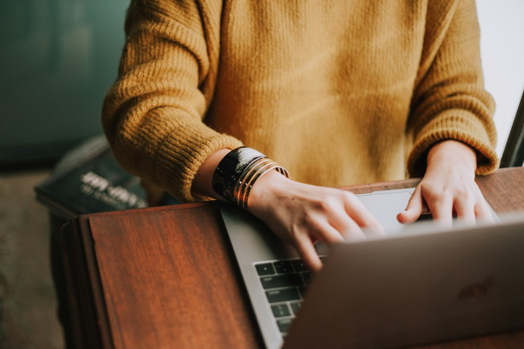 person using laptop computer - Photo by Christin Hume on Unsplash